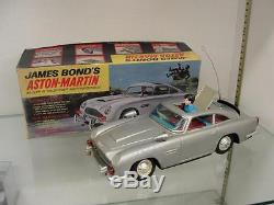 1965 A. C. GILBERT JAMES BOND ASTON-MARTIN BATTERY OPERATED TIN CAR With BOX