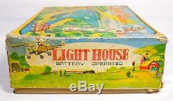 Beautiful Alps battery operated Tin lithographed Japan Light House in OB