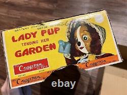 Vintage Battery Powered Lady Pup Tending Her Garden Cragstan Toy READ DESCRIPT