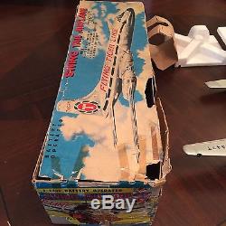 Vintage Marx swing tail battery operated FLYING TIGER toy airplane, MINT in box