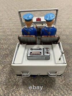 + Vintage Nomura Japan Tin Battery Operated Police Jeep with Firing Gun