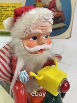 Vintage Santa Claus on Scooter Tin Litho Battery Operated Christmas Toy With Box