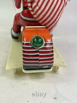 Vintage Santa Claus on Scooter Tin Litho Battery Operated Christmas Toy With Box