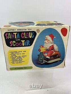 Vintage Santa Claus on Scooter Tin Litho Battery Operated Christmas Toy With Box