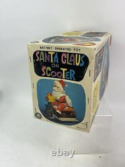 Vintage Santa Claus on Scooter Tin Litho Battery Operated Christmas Toy With Box