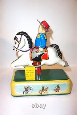 Vintage Yonezawa Galloping Cowboy Savings Bank battery operated Cragstan tin toy